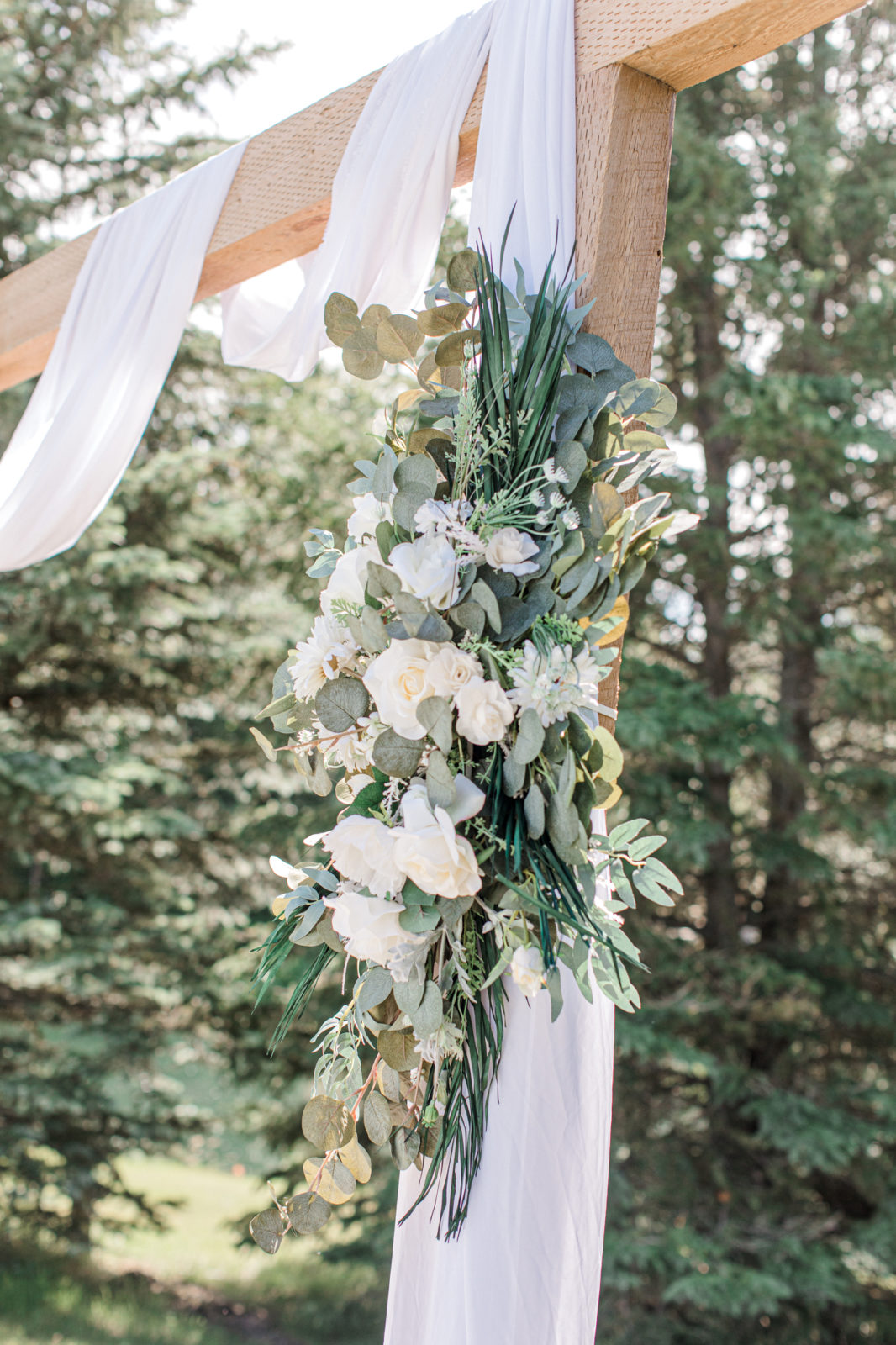 bridal archway, fabric, wood, and floral wedding arch