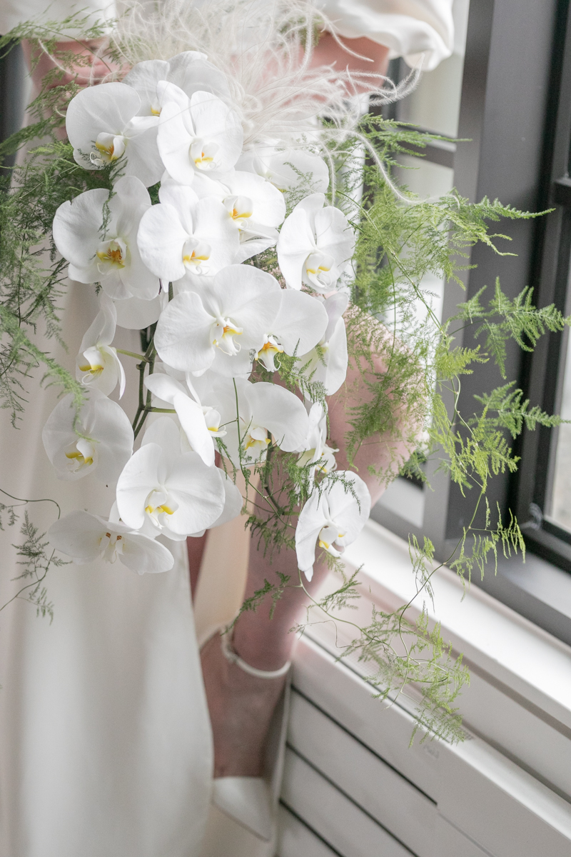 white orchids and green fern wedding bouquet, light and airy wedding inspiration, simple and modern wedding inspiration