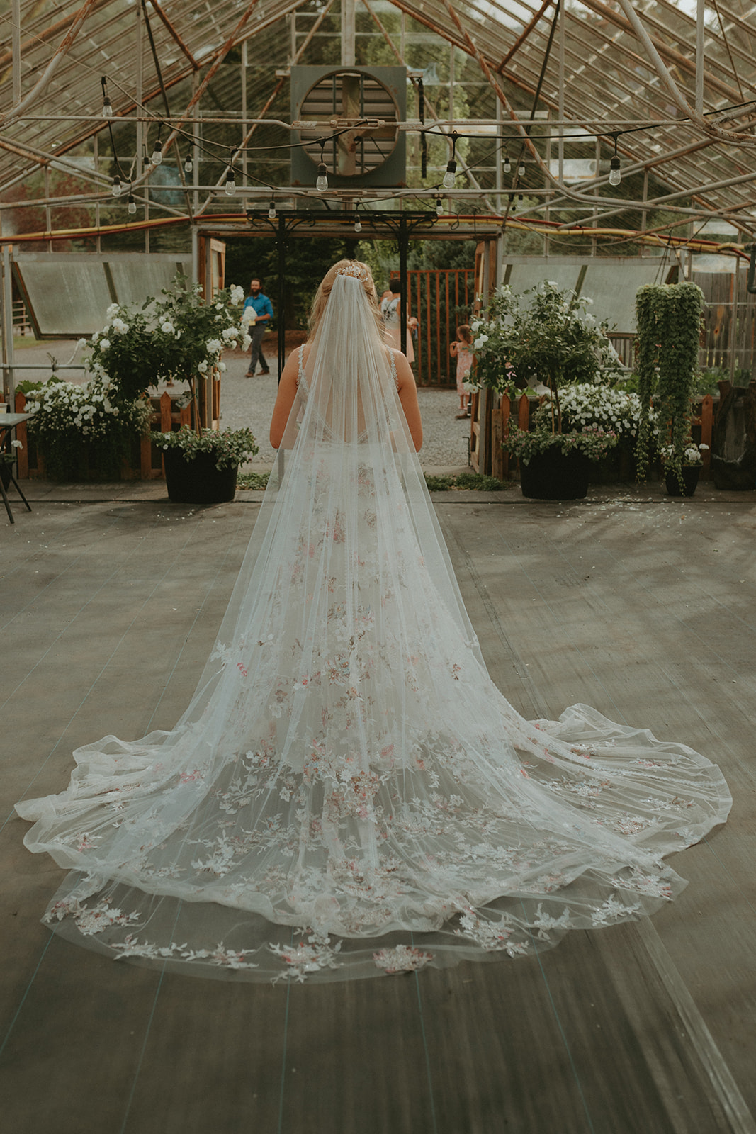 Bridal portrait with floral wedding gown and matching cathedral floral veil. Non-traditional bridal style, Wildflower greenhouse wedding, outdoor wedding inspiration, alternative wedding inspiration, boho wedding inspiration, patterned wedding dress