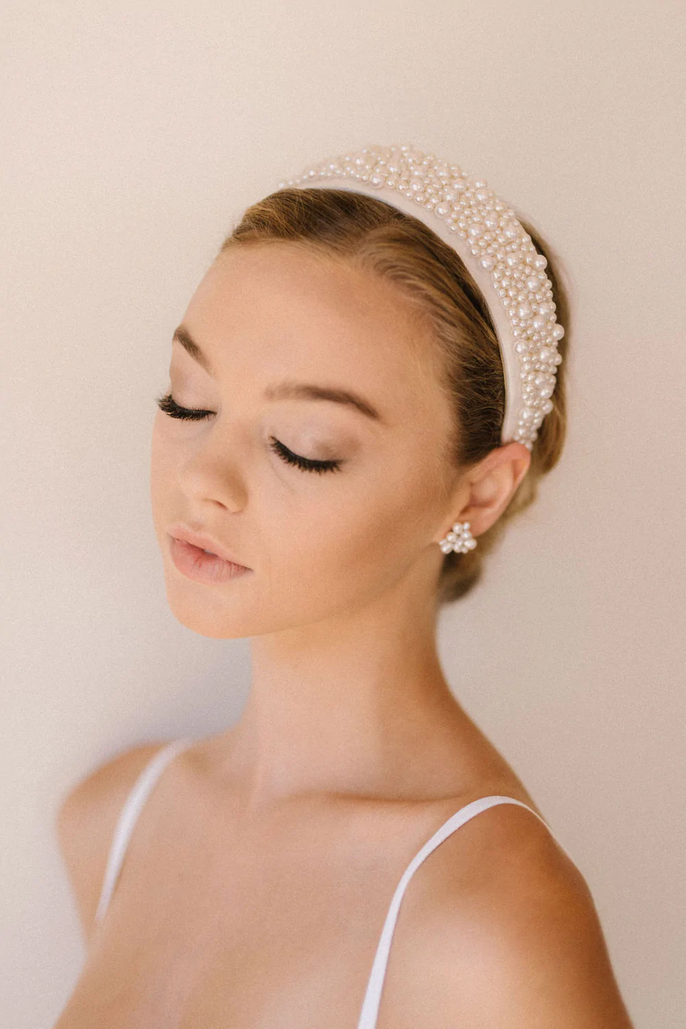 Couture bridal headbands from Untamed Petals. The Fallon Headband - A completely hand beaded headband adorned with countless pearls and woven into a handmade headband. 