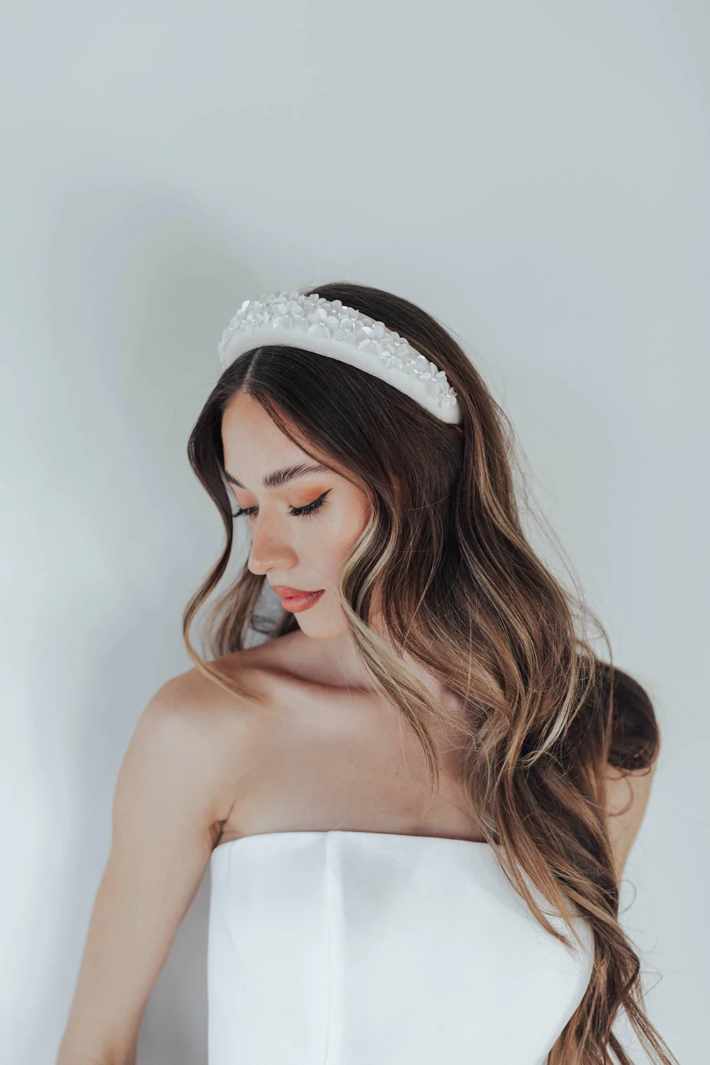 Hand beaded flowers with wired petals for molding on a padded statement headband... we love it! Bridal headbands from Untamed Petals