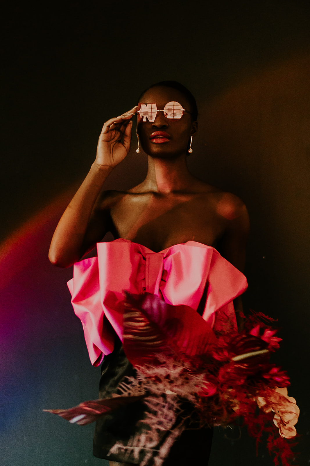 NO tinted sunglasses, pearl drop earrings, disco balls, and, rented pink gowns from Rock The Rental YYC combine to create this modern fuchsia fashion inspiration!