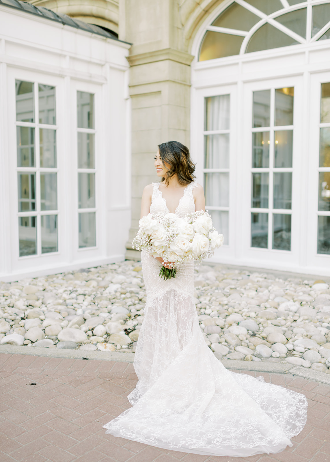 bridal portrait inspiration, modern and chic wedding gown, white bridal bouquet with baby's breath and roses