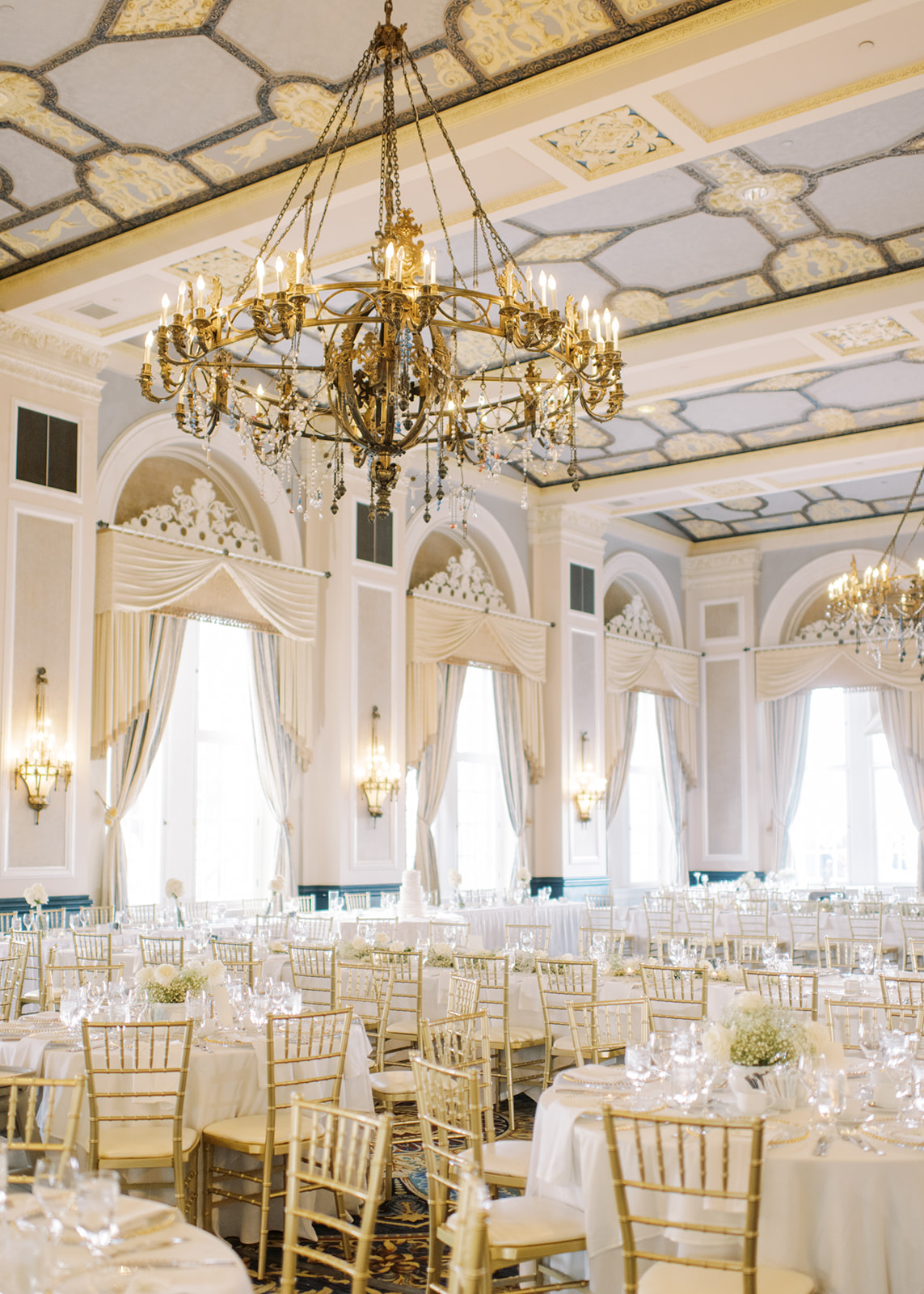 ballroom wedding with chandelier, luxe gold and white wedding, indoor ballroom reception