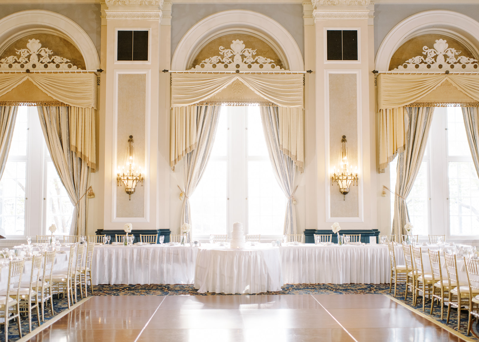 ballroom wedding with chandelier, luxe gold and white wedding 