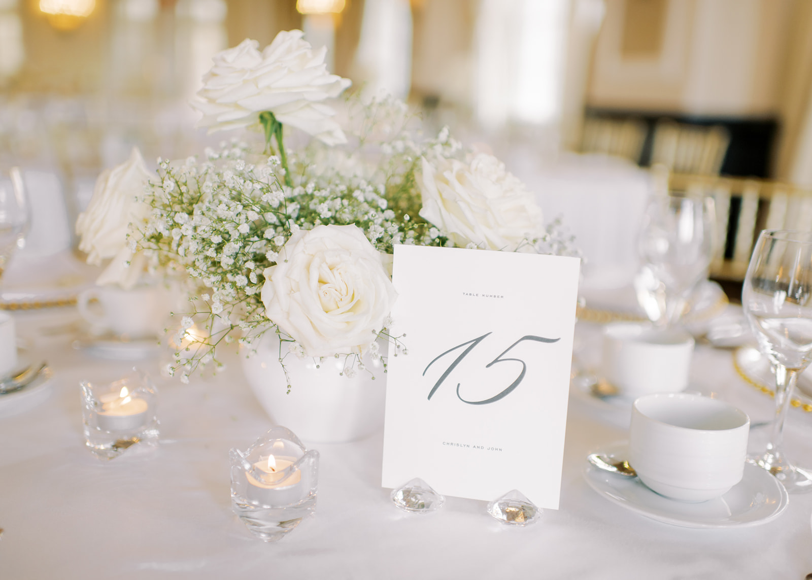 white wedding reception, baby's breath and roses at gold and white wedding