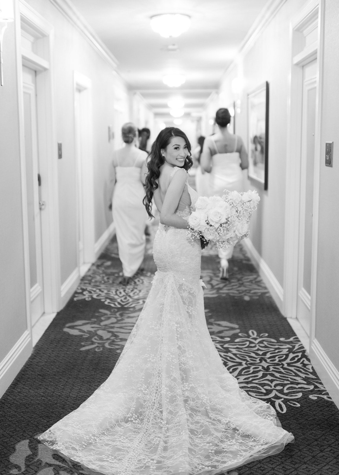 black and white wedding photography, bridal party walks down to ceremony