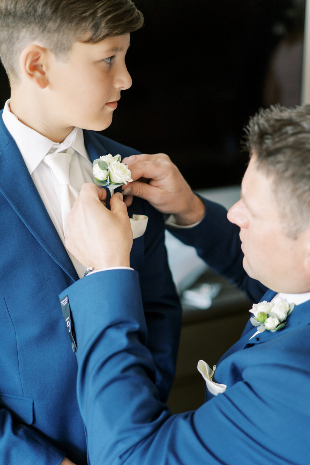 groomsmen and sons prepare for wedding day, navy wedding suit 