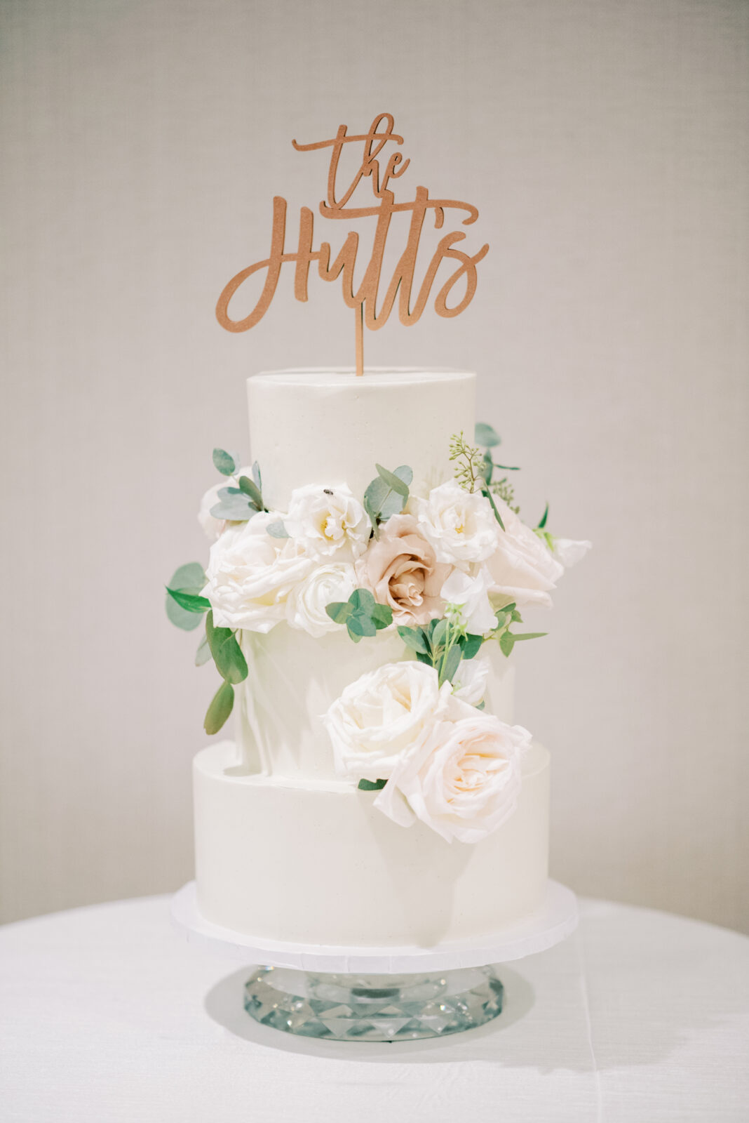 modern wedding cake with white florals and greenery 