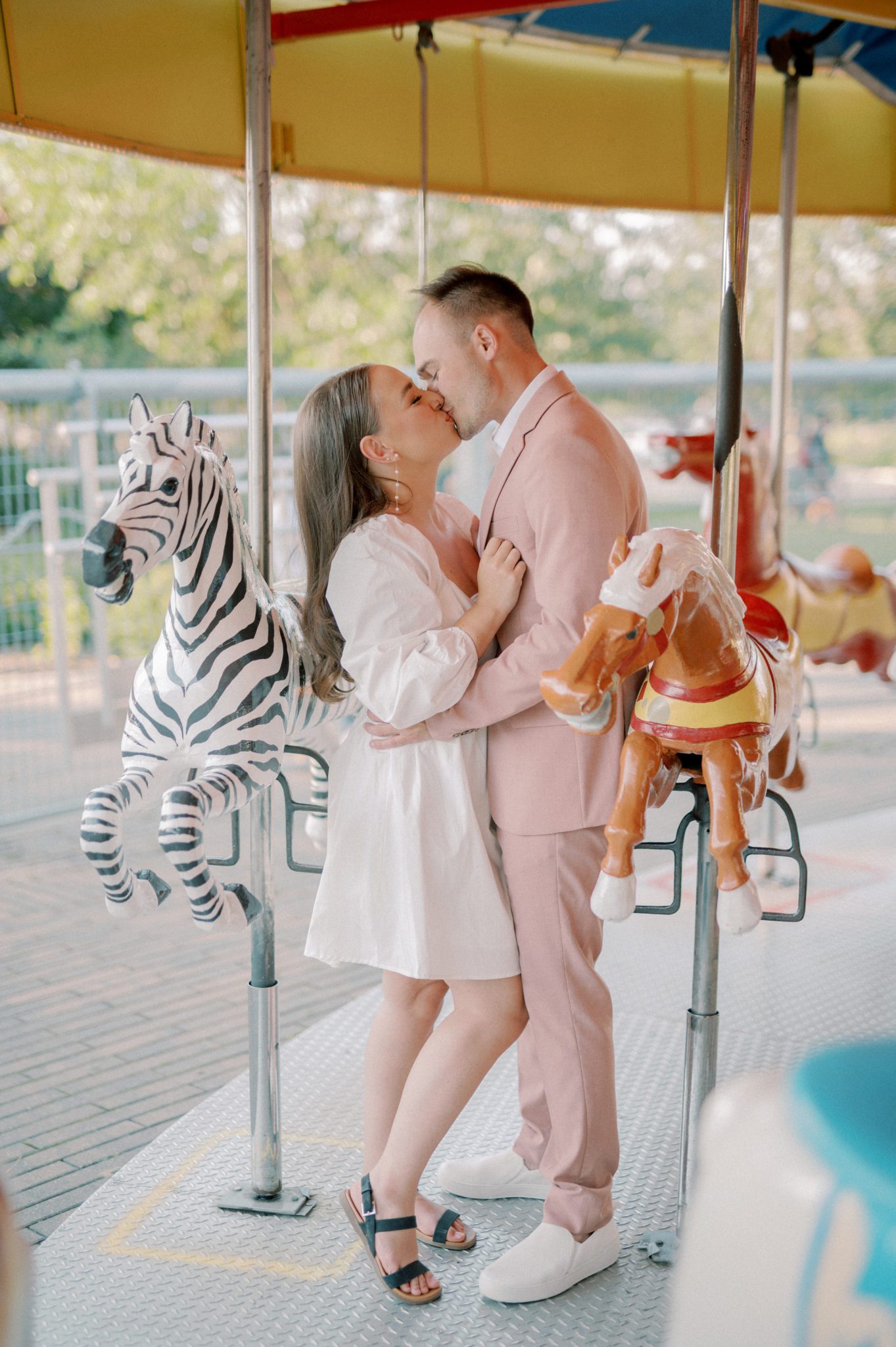 Outdoor summer engagement at carnival, outdoor couple photoshoot in summer, colourful engagement session 