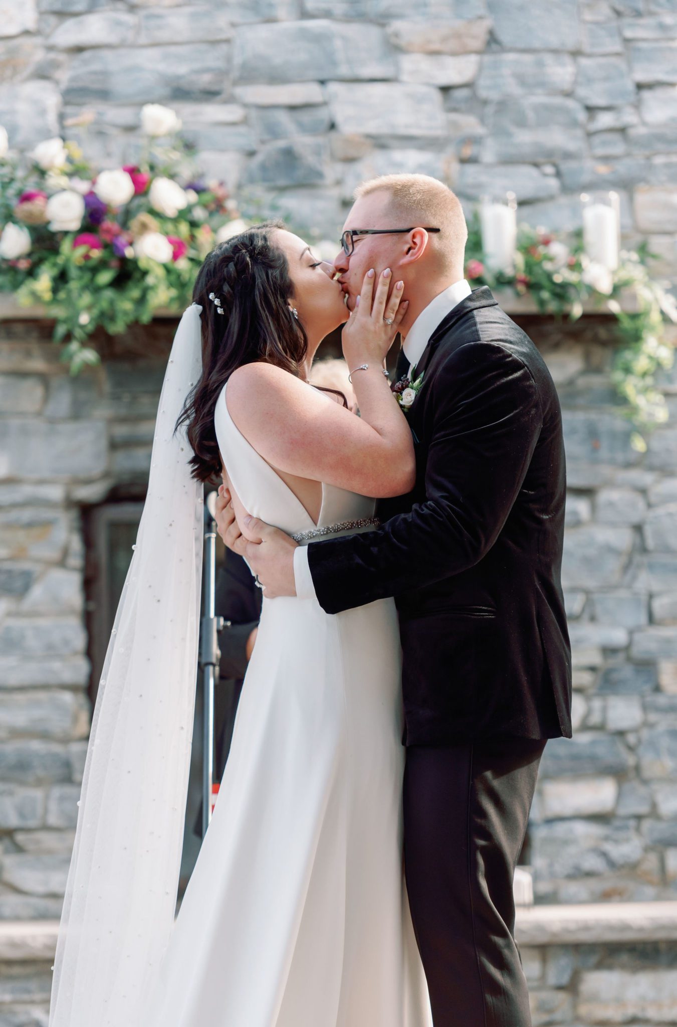 wedding first kiss at outdoor venue