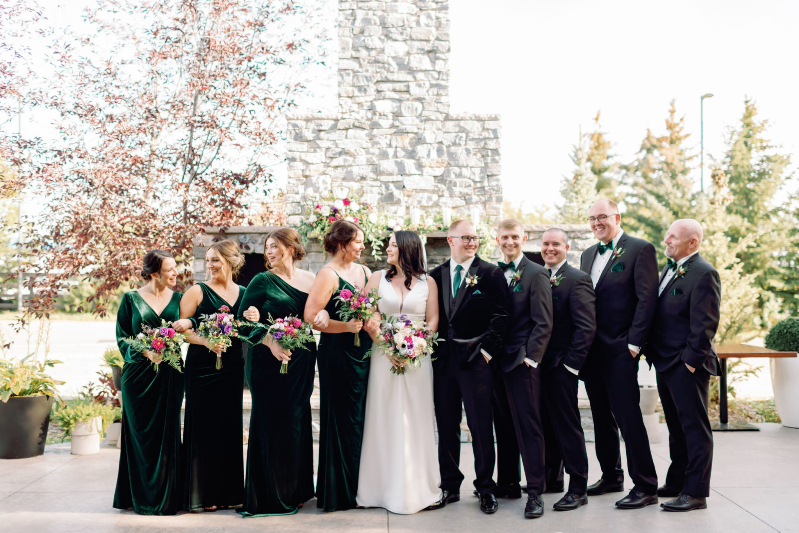 wedding party with velvet gown and suit, rich emerald bridesmaid dresses, Jewel toned Wedding Colour palette