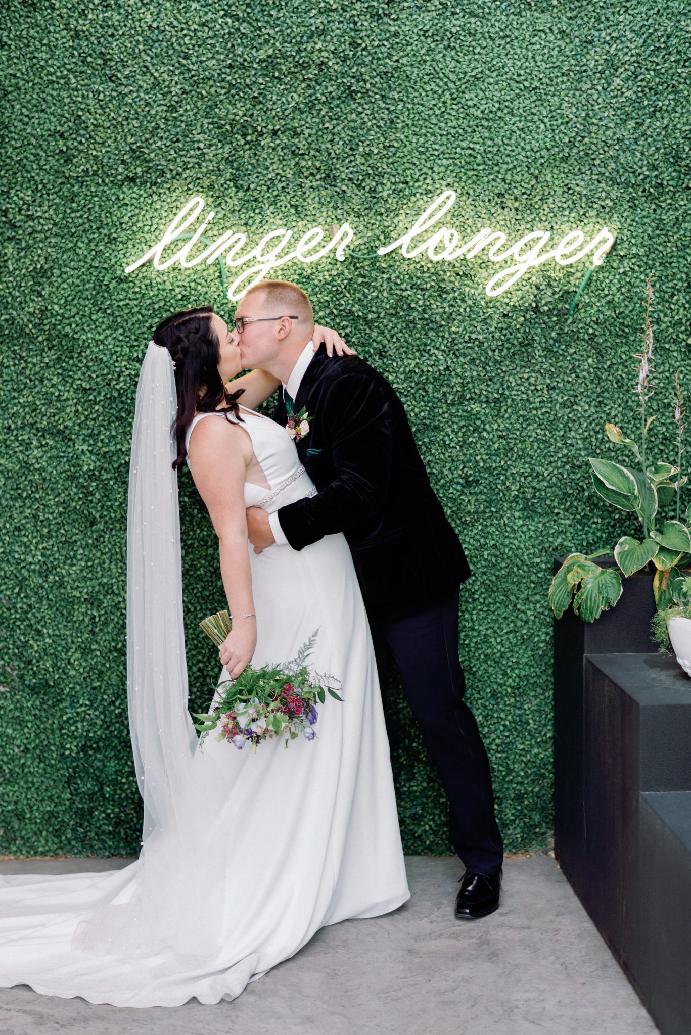 neon wedding signage, wedding kiss with faux foliage, wedding portraits, Jewel toned Wedding Colour palette