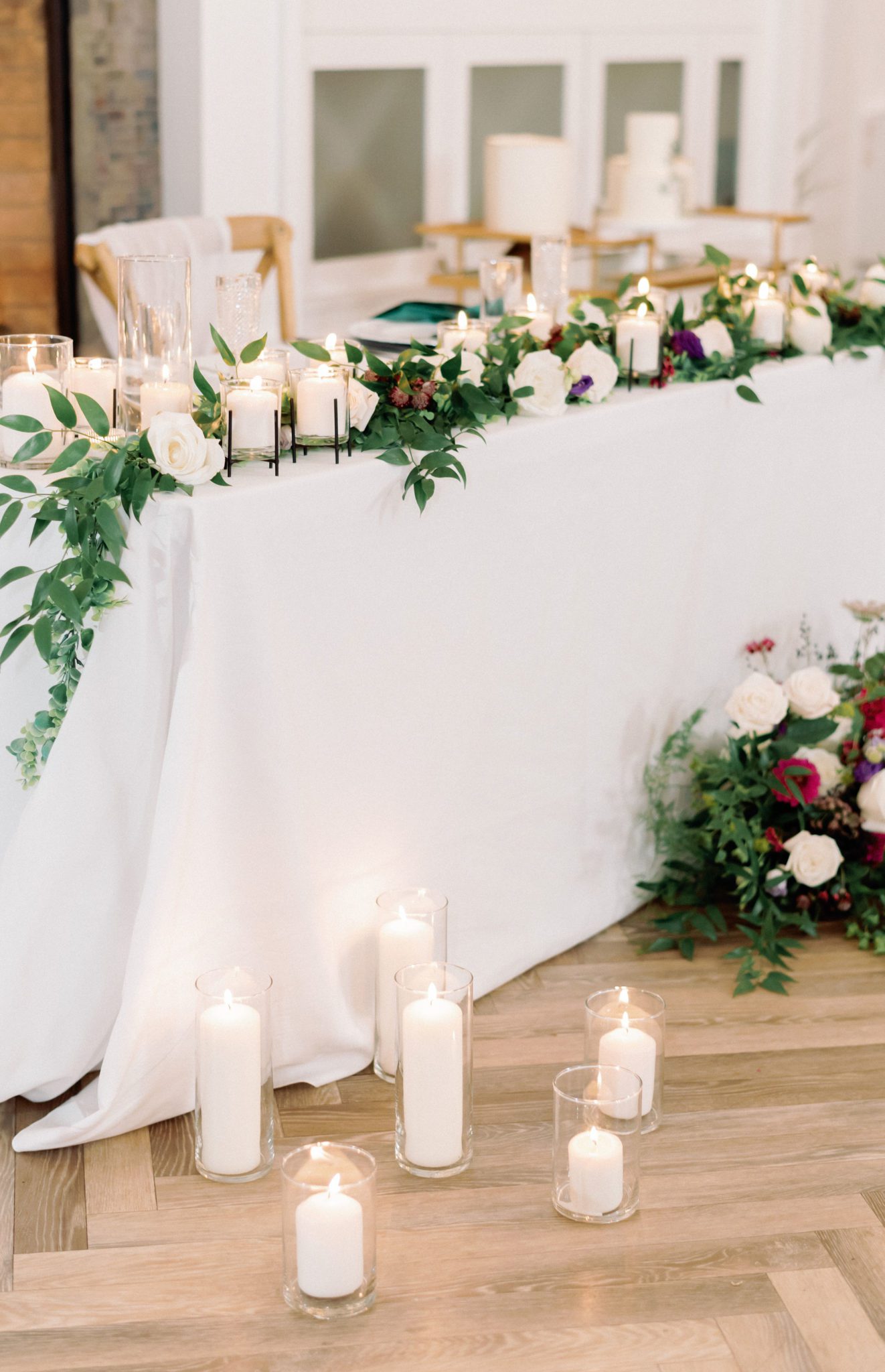 fireplace sweetheart table with candles and greenery, bright jewel toned wedding florals, Jewel toned Wedding Colour palette