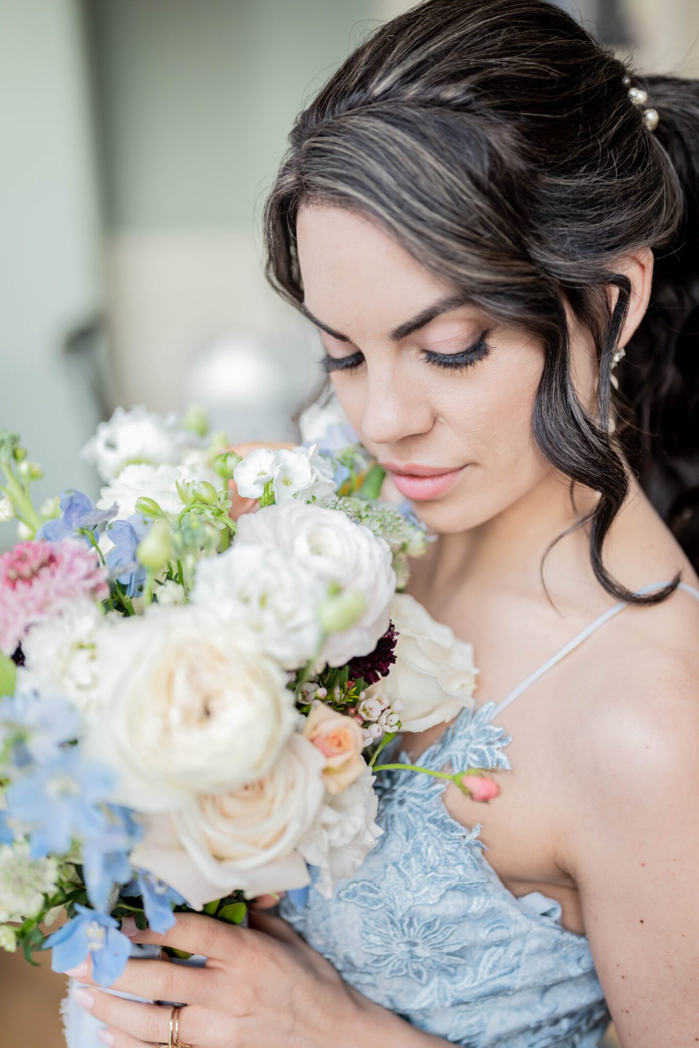 Feminine bridal portrait before ceremony holding pastel coloured bouquet, baby blue wedding dress inspiration, light and romantic bridal make-up by Anastasia K Makeup Artist  
