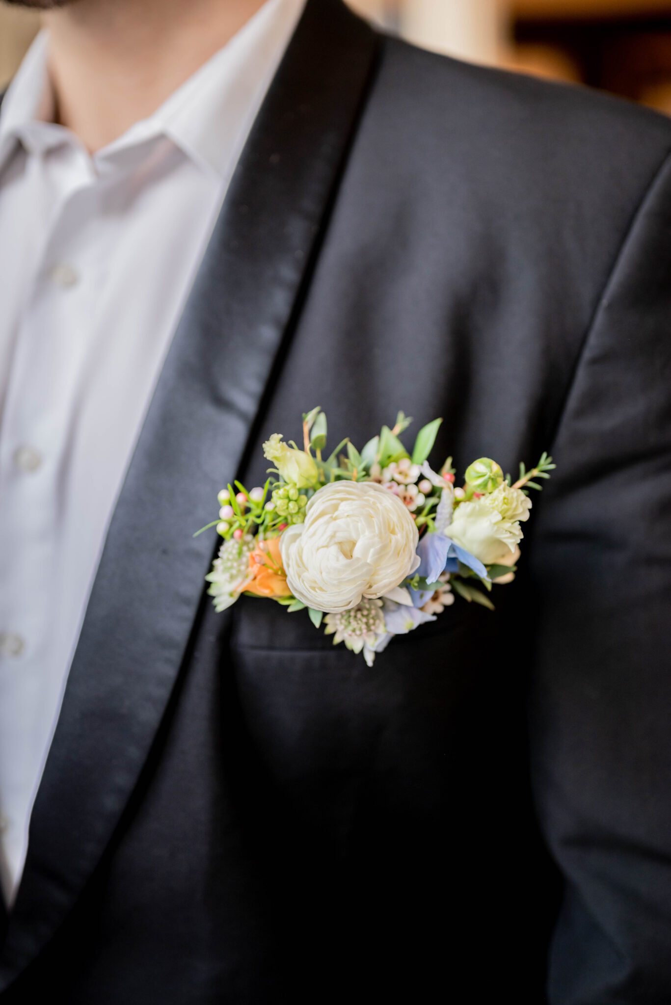 Delicate spring floral boutonniere for groom, pastel wedding colour inspiration, timeless groom attire for spring wedding  
