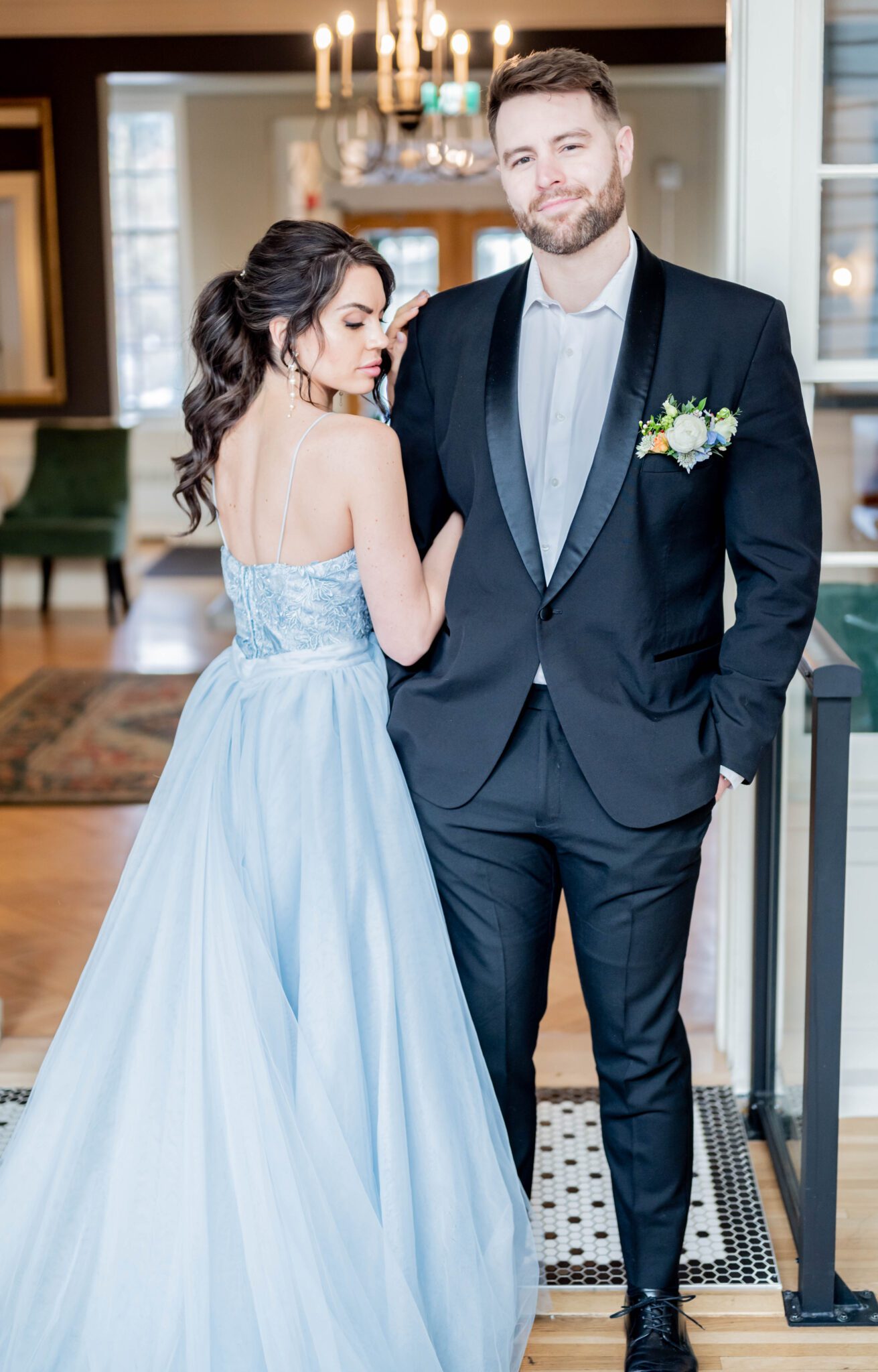 Bride and groom portrait in a mesmerizing baby blue wedding dress and timeless black suit by Derks Formal