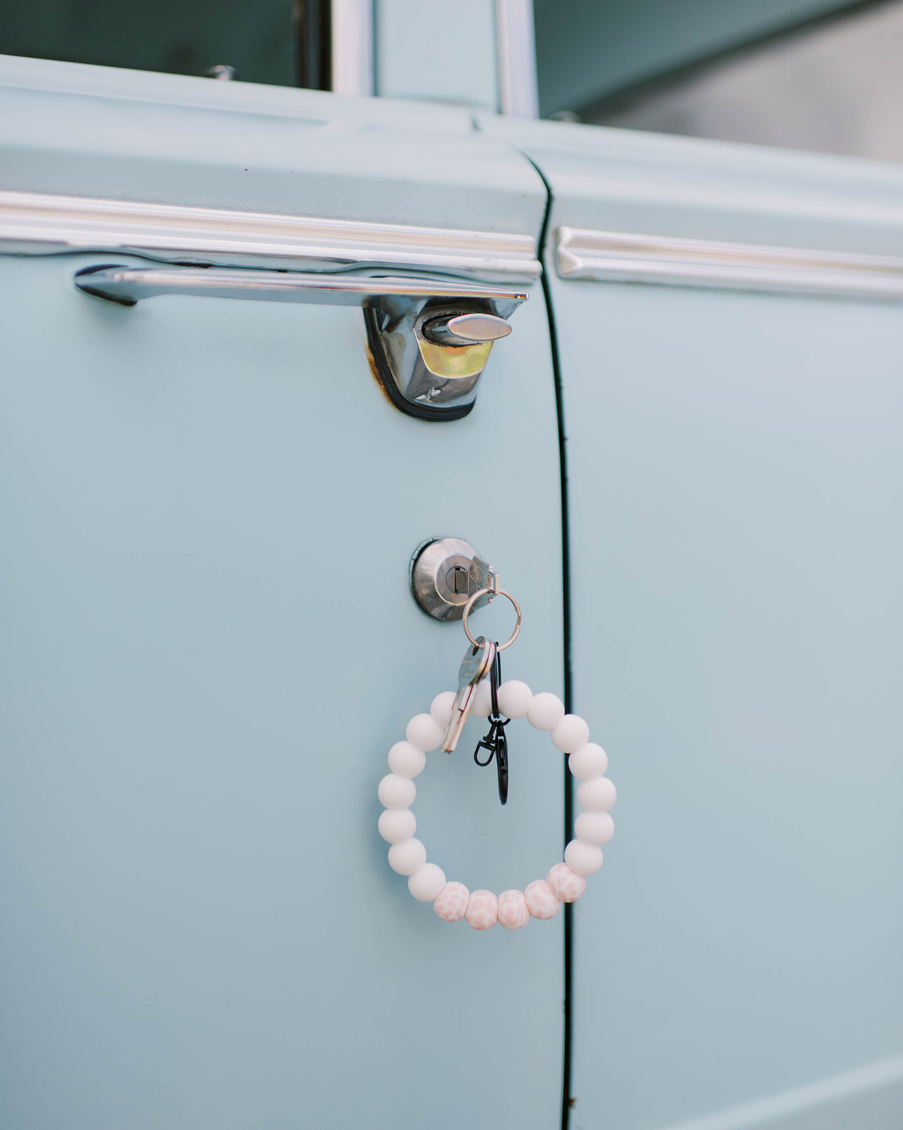 Iconic baby blue vintage car rental adding a touch of nostalgia to Okanagan weddings, Kelowna wedding photographer captures the romance of a fine art summer wedding with a vintage car