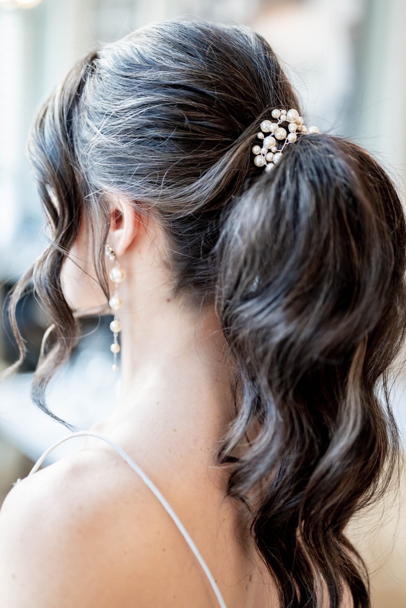 Bridal ponytail hairstyle with pearl hair piece, bridal portrait featuring ponytail hairstyle by Sweet Sage Bridal Services