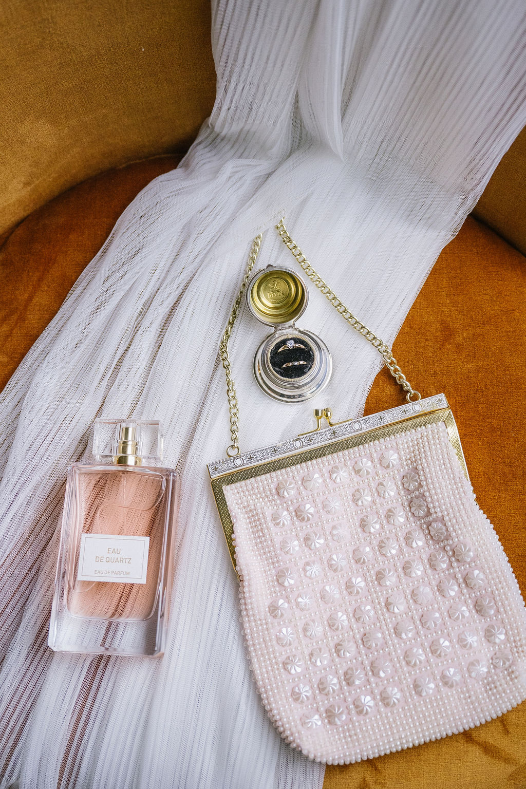 wedding flat-lay, bridal flat-lay with perfume and clutch, pink bridal details