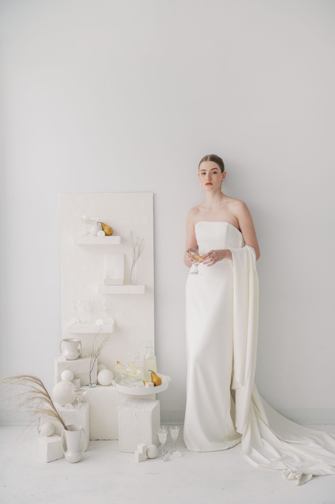 Grecian style wedding gown by Aesling: a fashionable choice for modern brides, plaster shelf for place cards set up in Studio Boheme