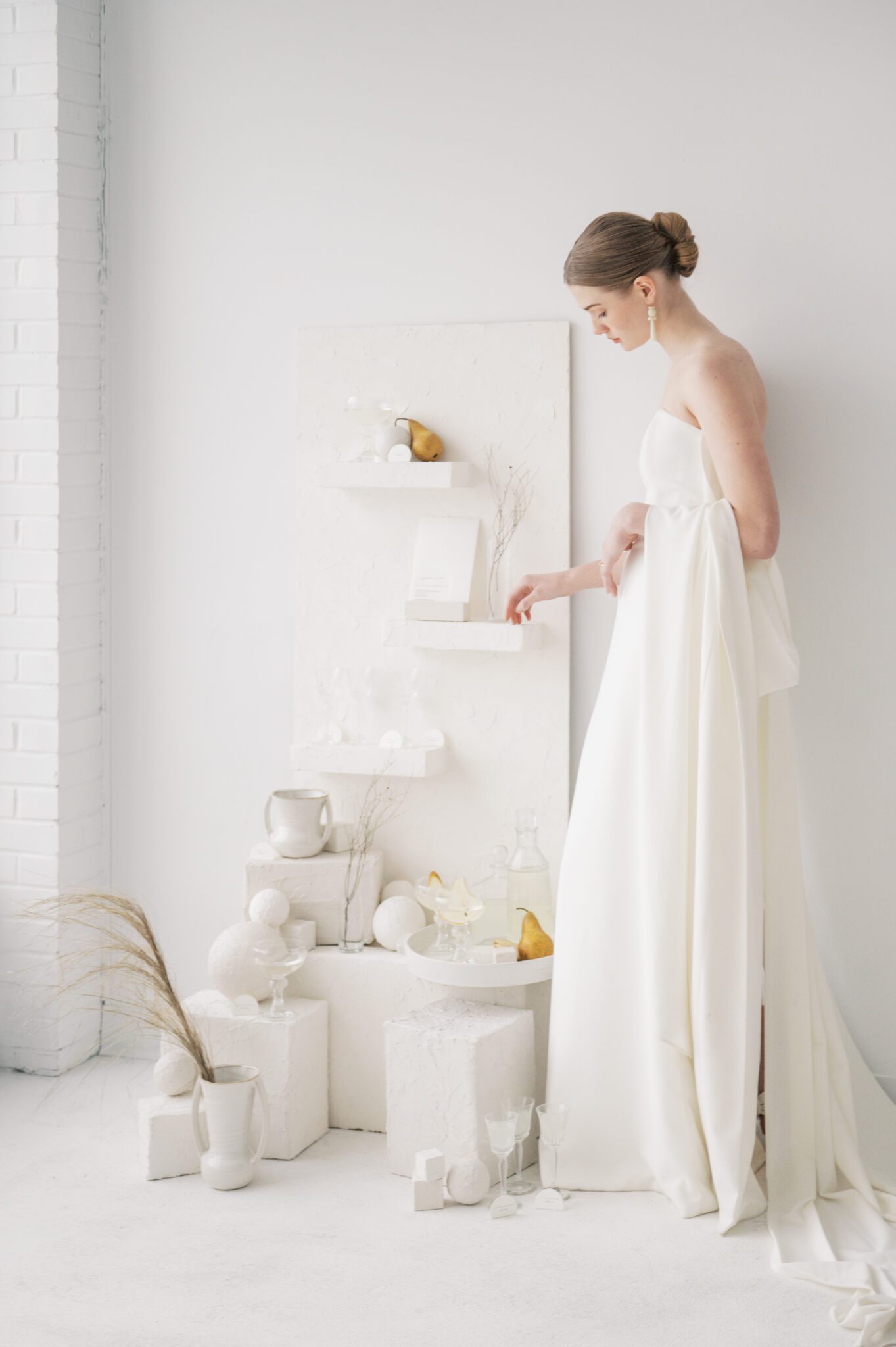 Grecian style wedding gown by Aesling: a fashionable choice for modern brides, Avant-garde wedding style with innovative floral arrangements on plaster shelf