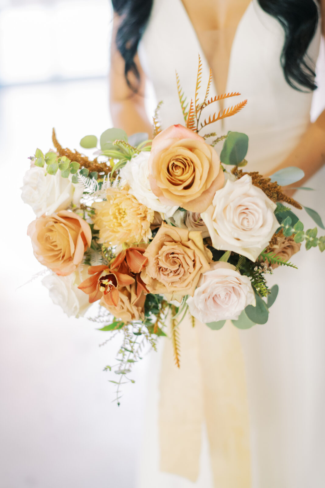 Fall wedding colour scheme with a harmonious blend of autumnal hues for bridal bouquet by Therese Lopez Florals, bride's bouquet details photo