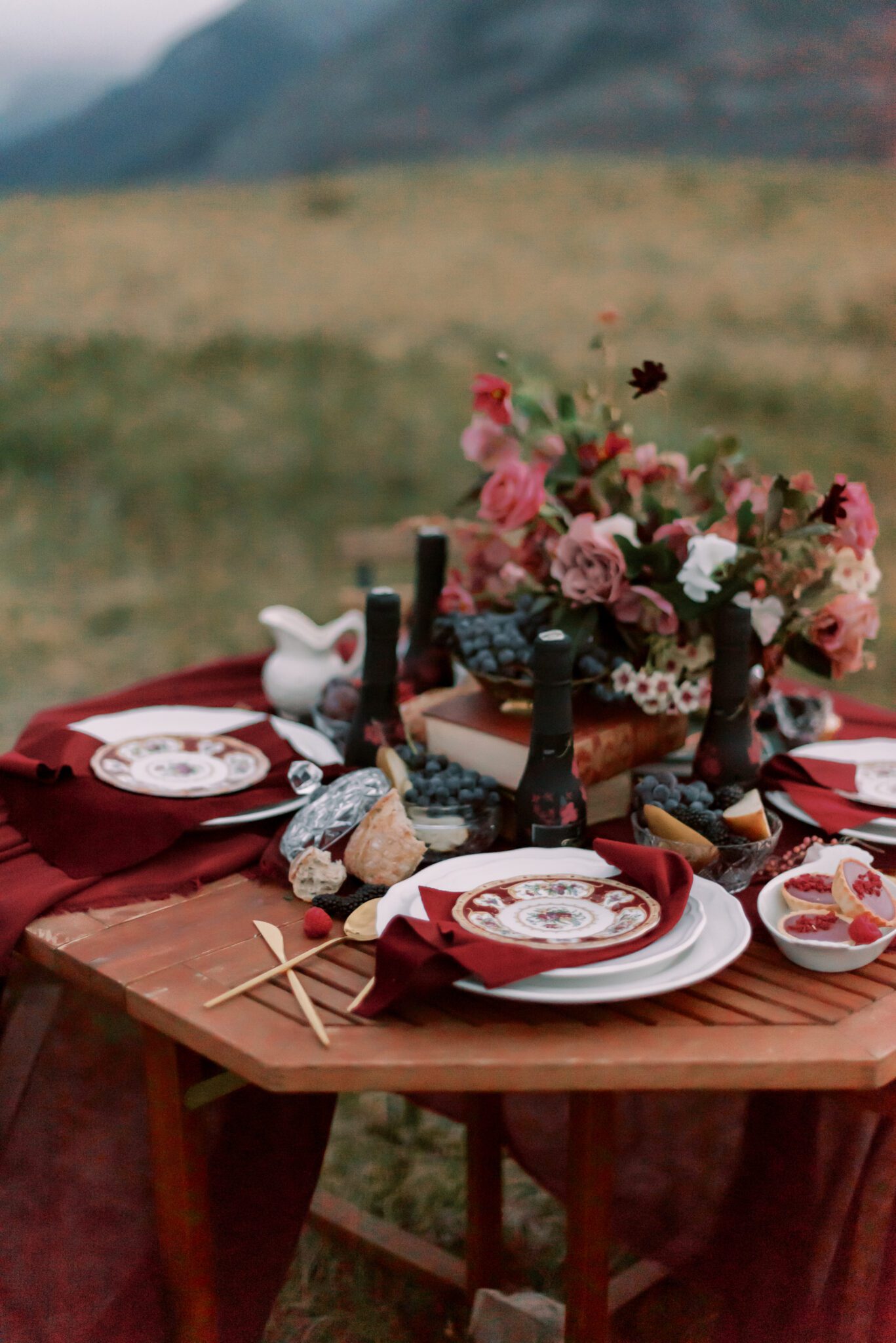 Intimate table setting outdoors in Waterton Alberta, Fall Wedding Inspiration, Merlot and berry toned  florals by Alexandra Victoria Rose, desserts by Lemonberry Pastries