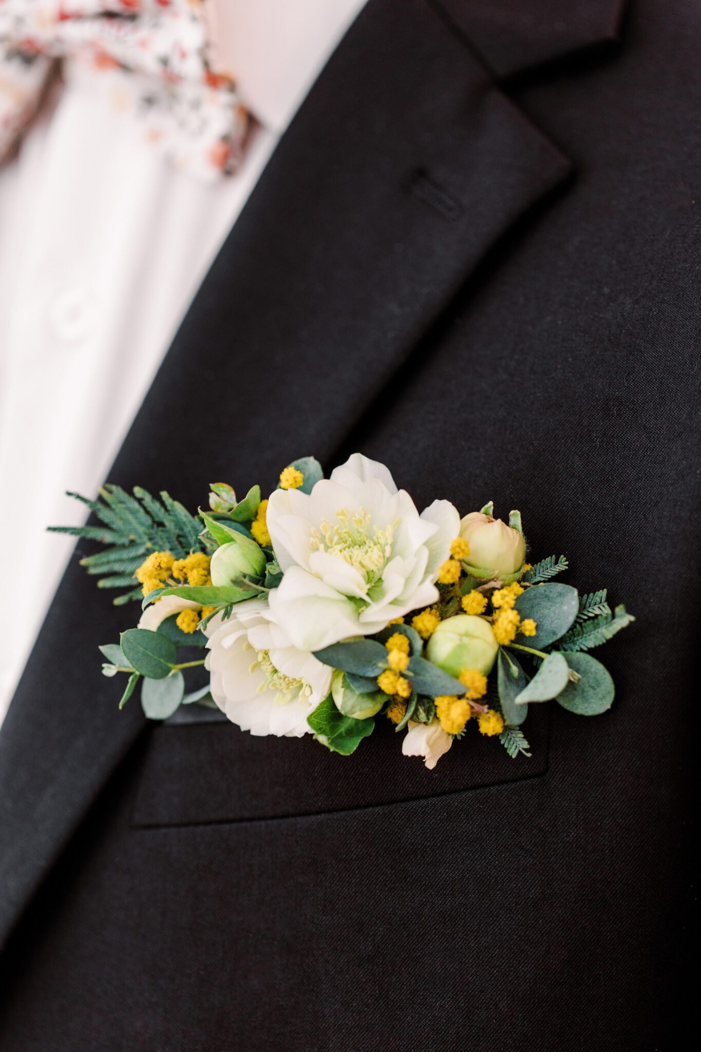 Groom wearing yellow and pink spring inspired wedding boutonniere created by Little Petal Company and floral bowtie, groom fashion inspiration, spring wedding ideas