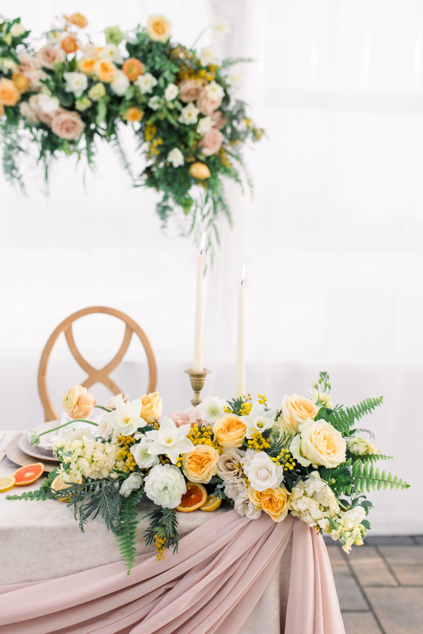 Yellow and peach wedding florals designed by Little Petal Company, summer wedding inspiration, summer wedding ideas, sweetheart table inspiration
