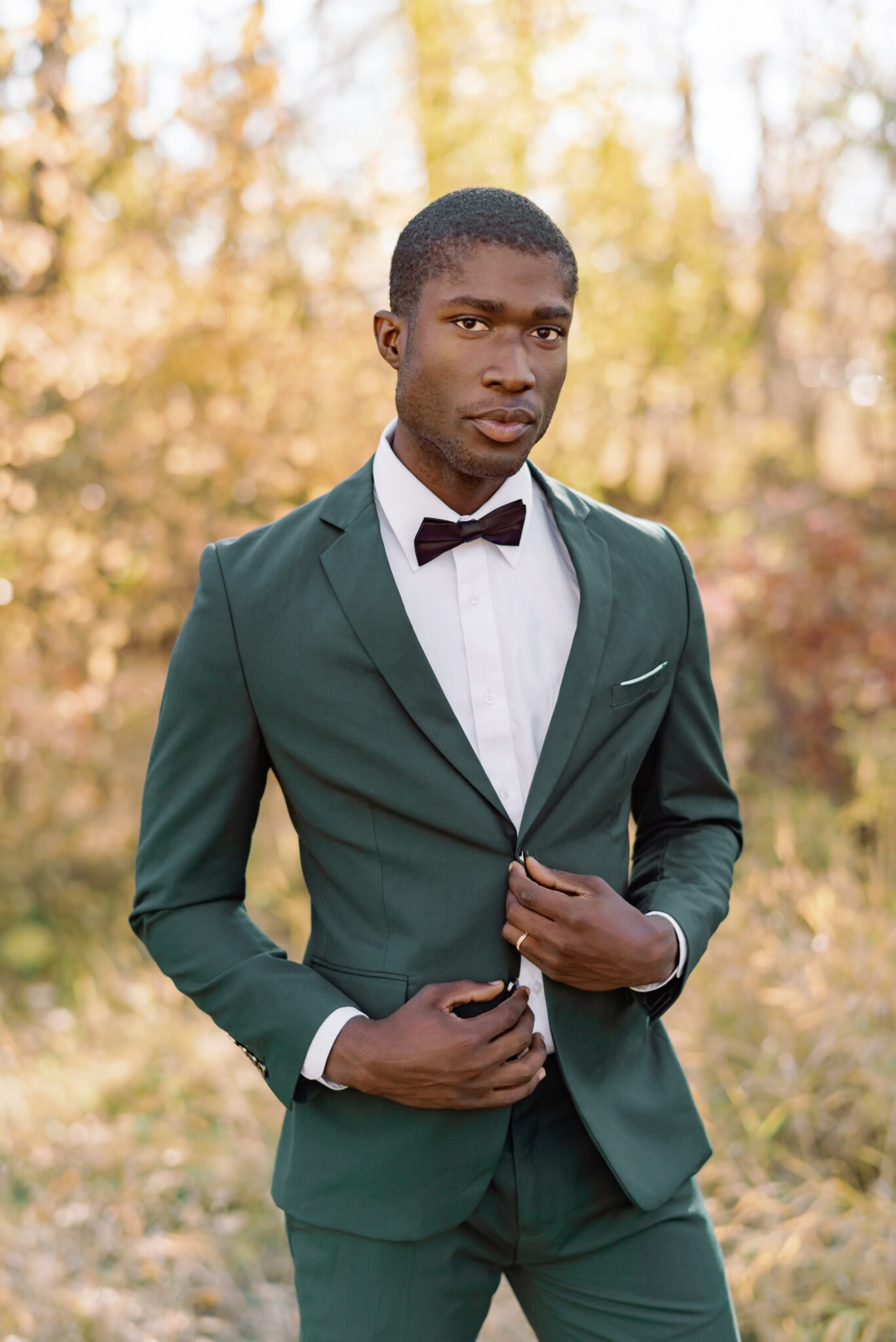 Groom wearing emerald green suit at outdoor Fall wedding. Fine art photography by Kaity Body.