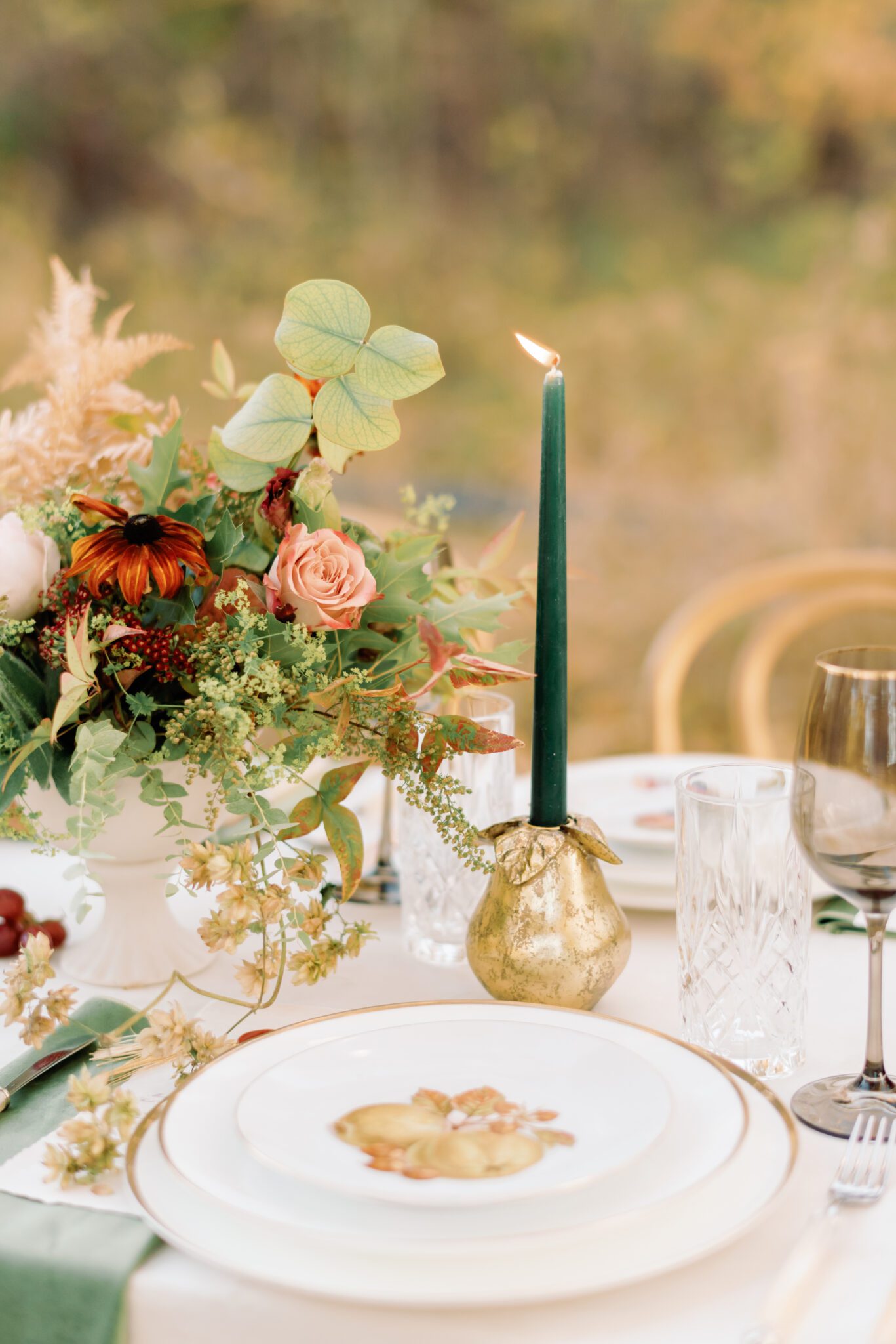 Al fresco dining at golden hour. Wedding reception tablescape featuring olive green, burgundy and rust details, elegant menus with crimson wax seals and gold tassel accents. Intimate autumn wedding designed and planned by Rebekah Bronte. 