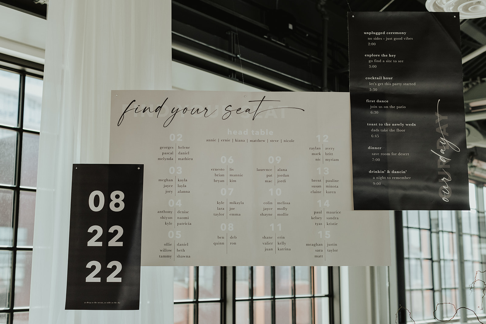 Black and nude coloured custom hanging wedding signage at The Wallace Venue in North Vancouver. 