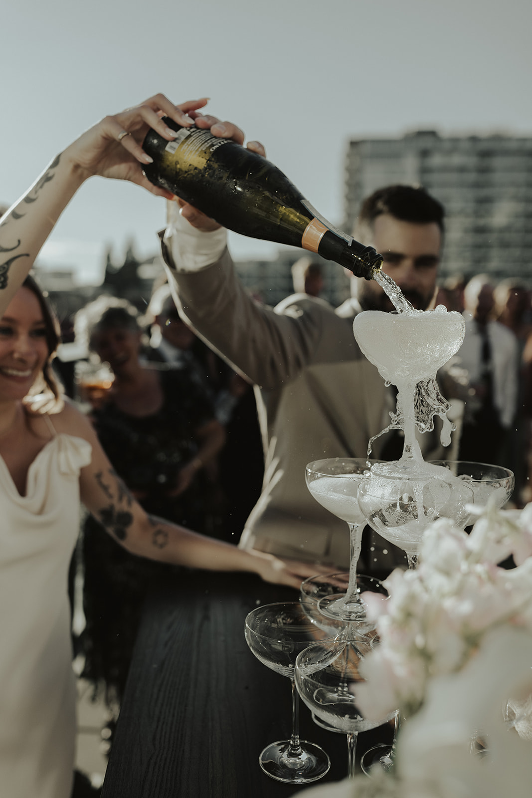 Bride and groom pouring champagne tower at The Wallace Venue in North Vancouver. 