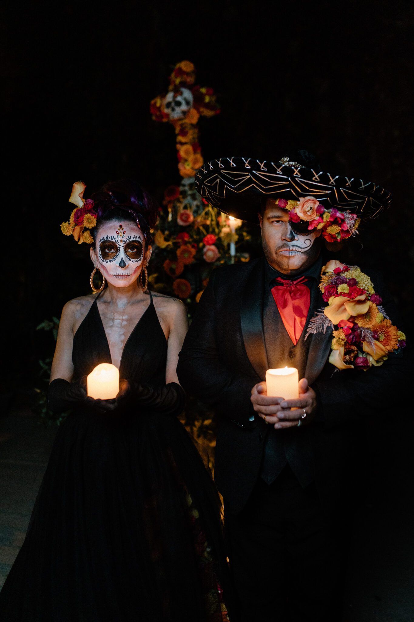 Couple holding candles in mystical Day of the Dead inspiration photo, captured by Nikki Collette. 