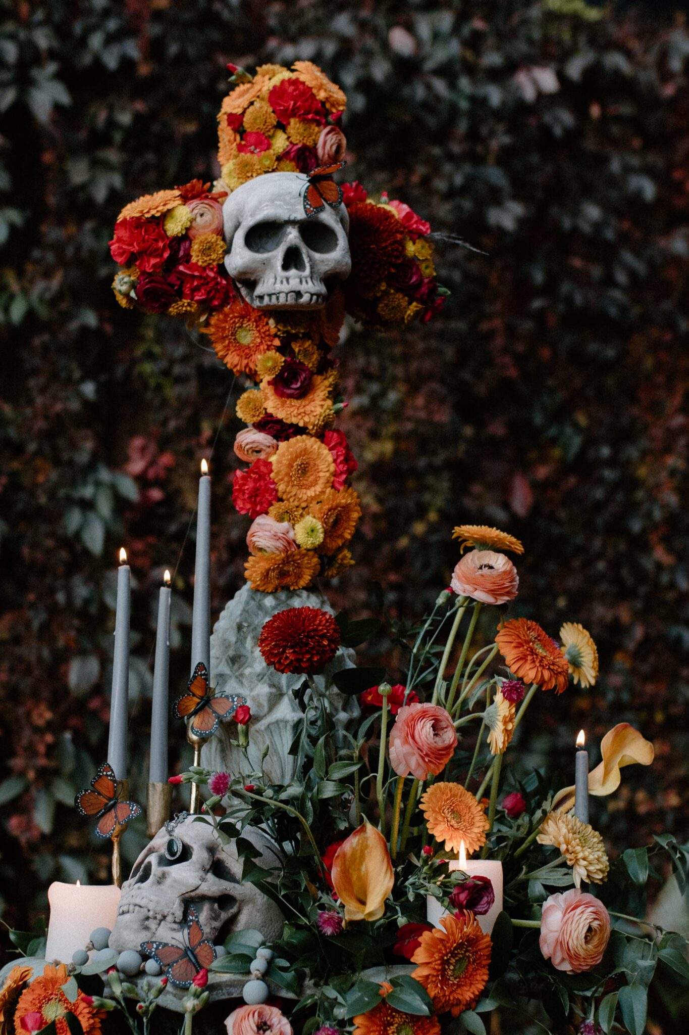Halloween inspired decor featuring skulls, candles, and florals by Calyx Floral Design. Image captured by Red Deer Wedding Photographer, Nikki Collette.