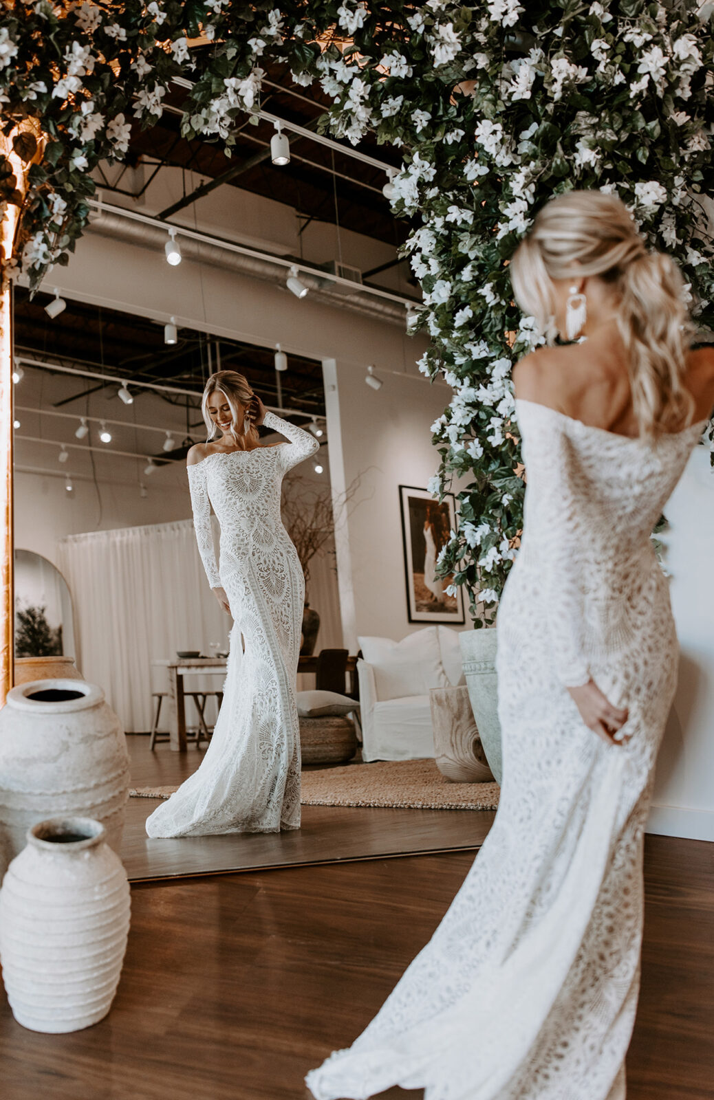 Brides wearing stunning off the shoulder lace gown with sleeves, designed by Grace Loves Lace. Bridal appointment tips.