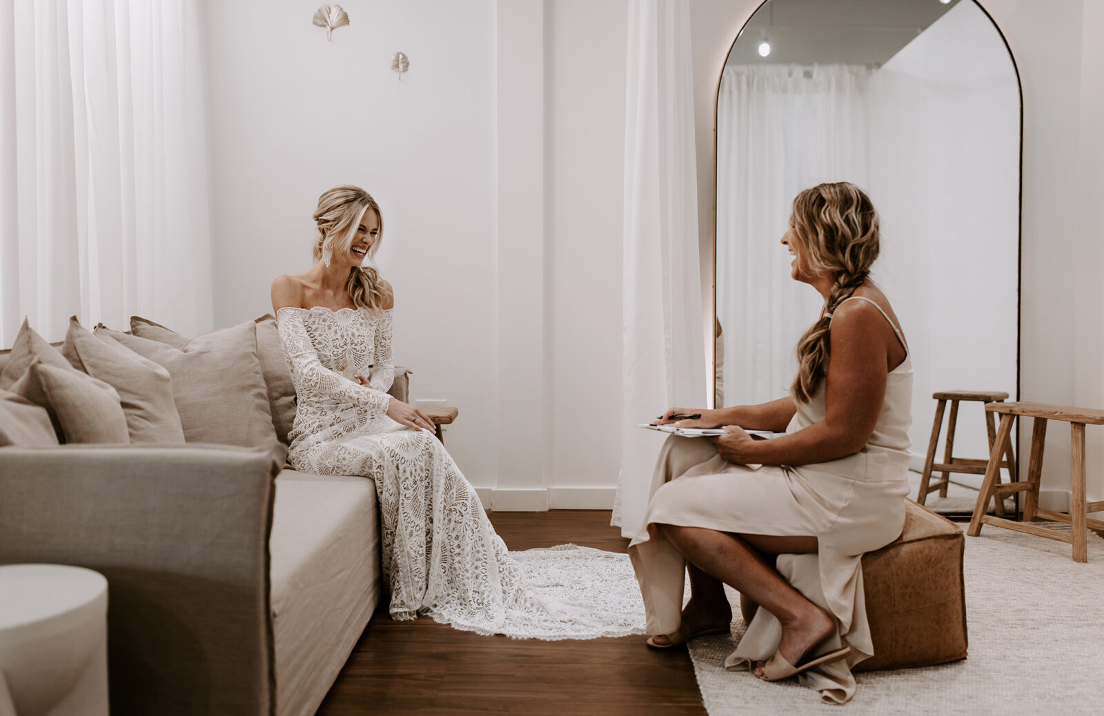 Brides wearing stunning off the shoulder lace gown with sleeves, designed by Grace Loves Lace. Bridal appointment tips.