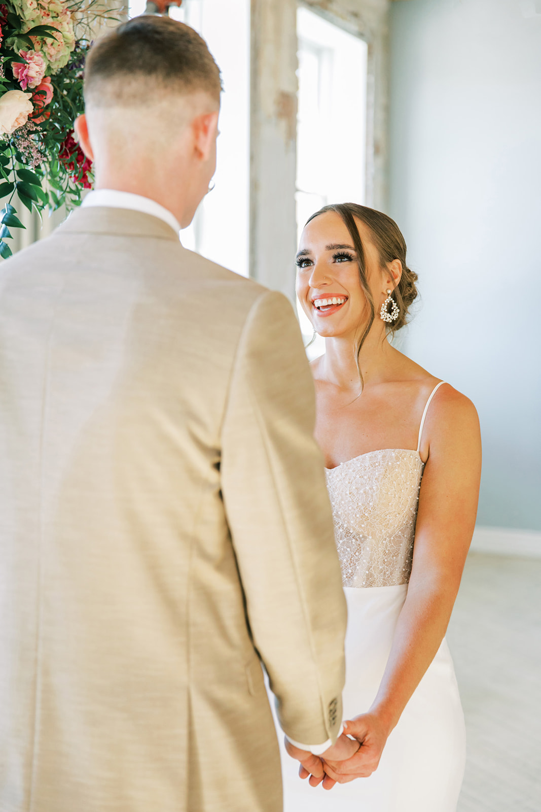 Couple smiling during romantic, vintage inspired wedding ceremony captured by Jenelle Quigley Photography in Regina.