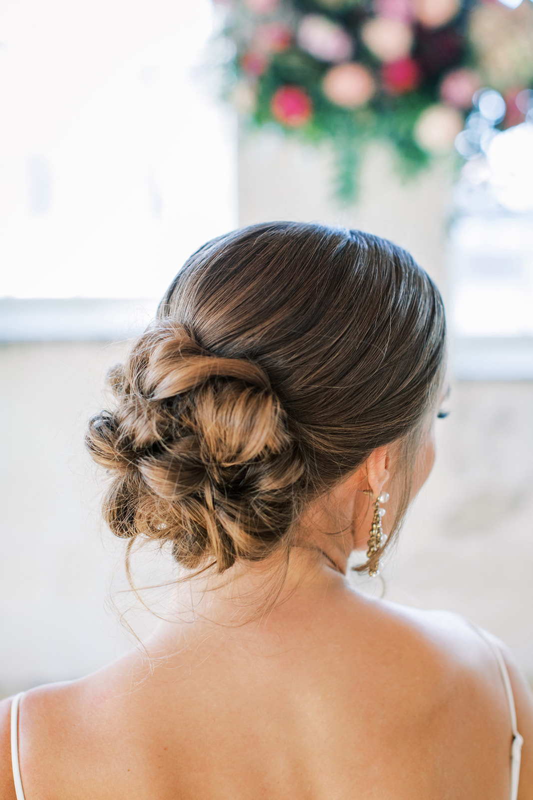 Stunning bridal hair inspiration, low bun hairstyle by Oksana Van Staveren in Regina, Saskatchewan.