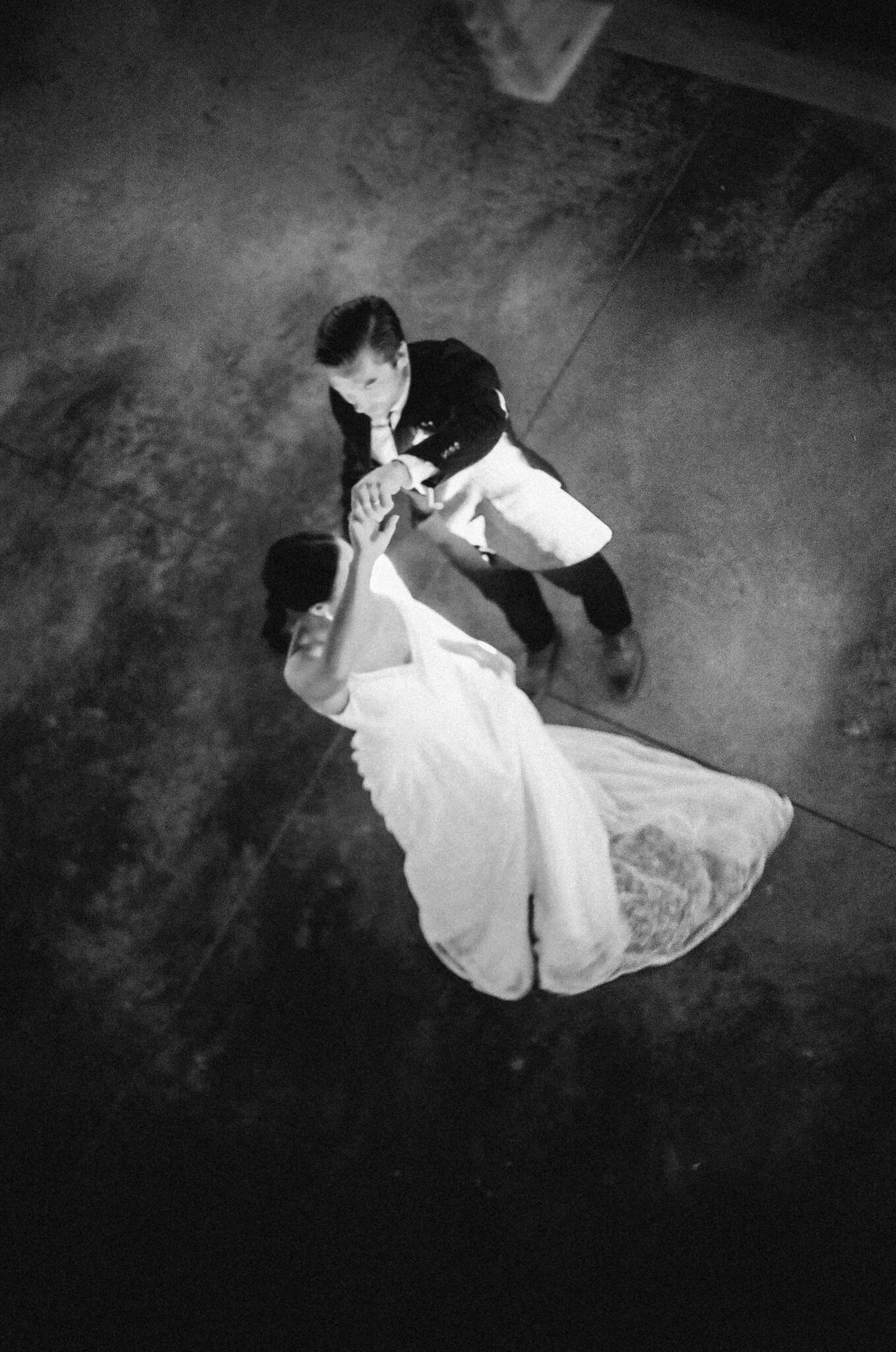 Wedding Inspiration With An Updated Take on Country Chic Wedding Style at Countryside Barn in Lethbridge Alberta, black and white film portrait of bride and groom dancing, film photography style.