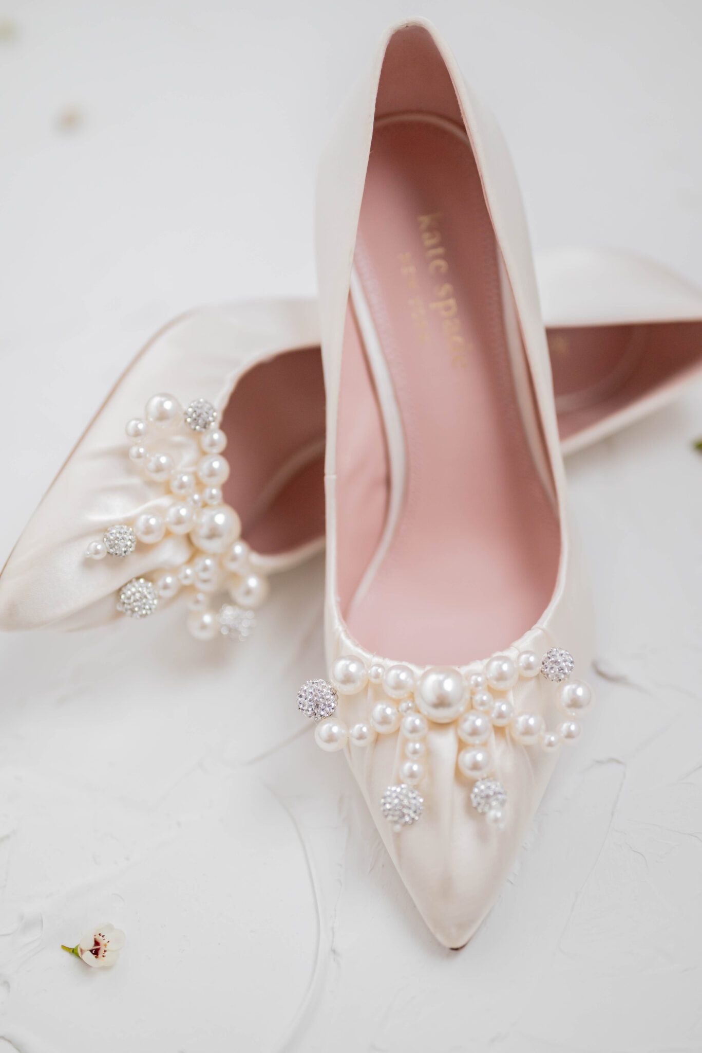 Elegant Kate Spade bridal shoes with delicate pearl detailing, detail photo inspiration. 