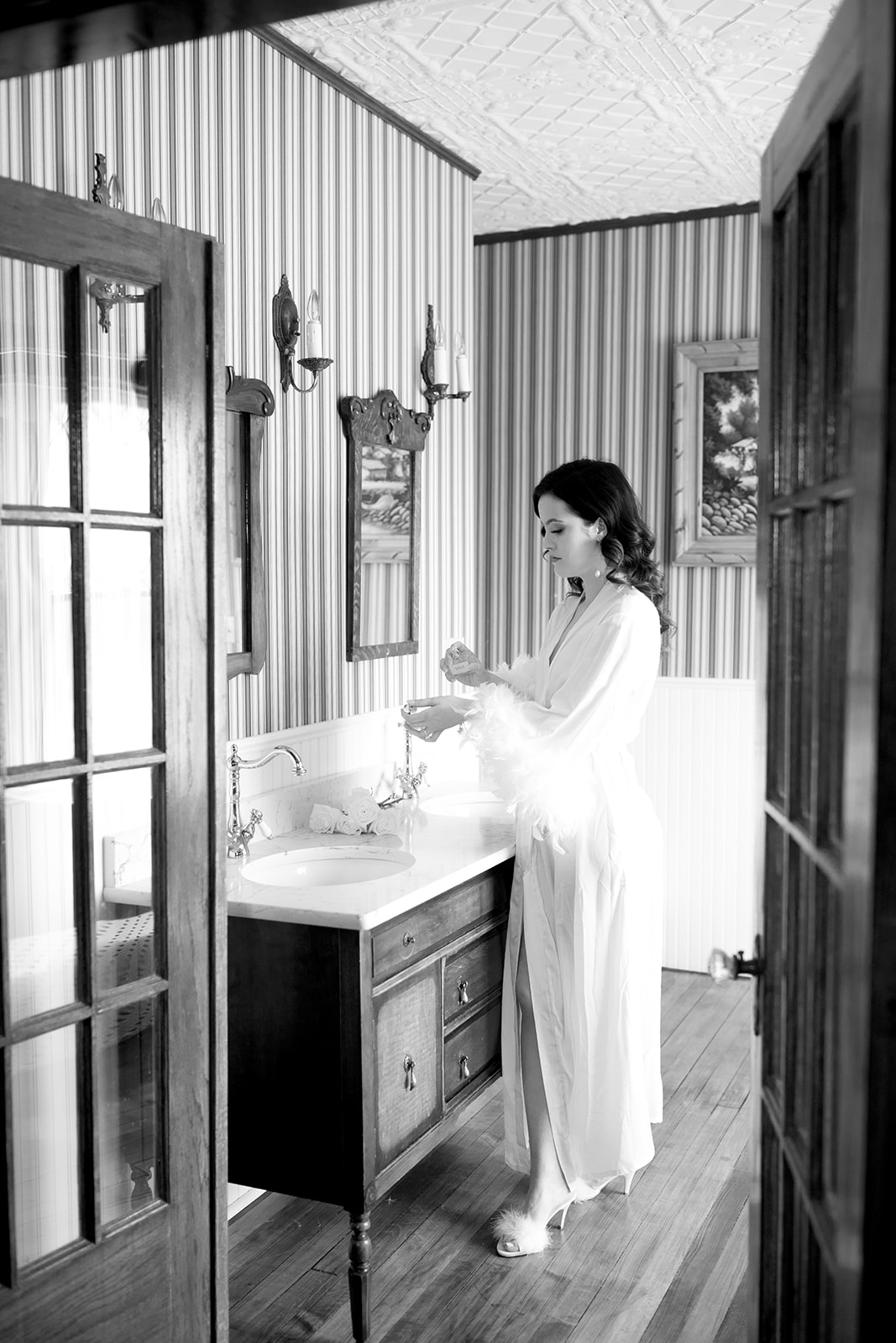 Chic Bridal Inspiration & Getting Ready Photos Perfect for the Fashion-Forward Bride. Bride wearing feather lined robe.