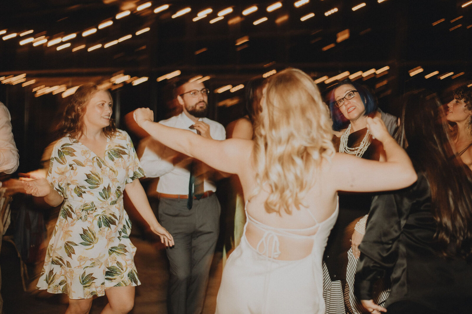 Fun portrait of the dance party at this intimate vineyard wedding reception in the Okanagan.