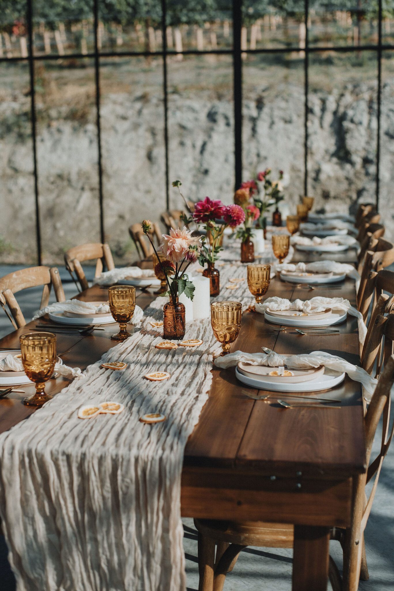 Intimate vineyard wedding reception details, with colourful vintage glassware, and neutral table setting details, intimate vineyard wedding. 