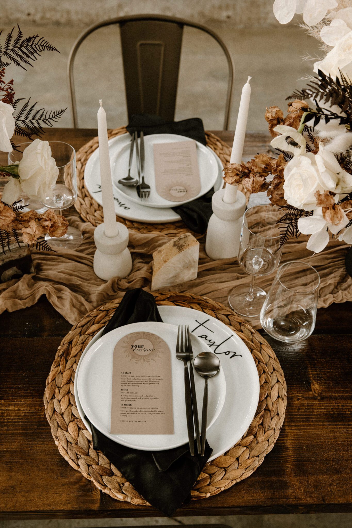 Rich brown textures and tones featured in this tablescape at 52 North Venue, featured a mix of dried and fresh florals, cream-coloured taper candles, warm and moody inspiration. 