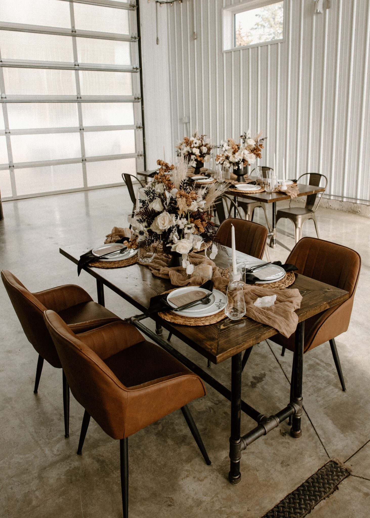 Reception room details featuring rich brown textures and tones at 52 North Venue, warm-toned floral arrangements, warm and moody wedding inspiration. 