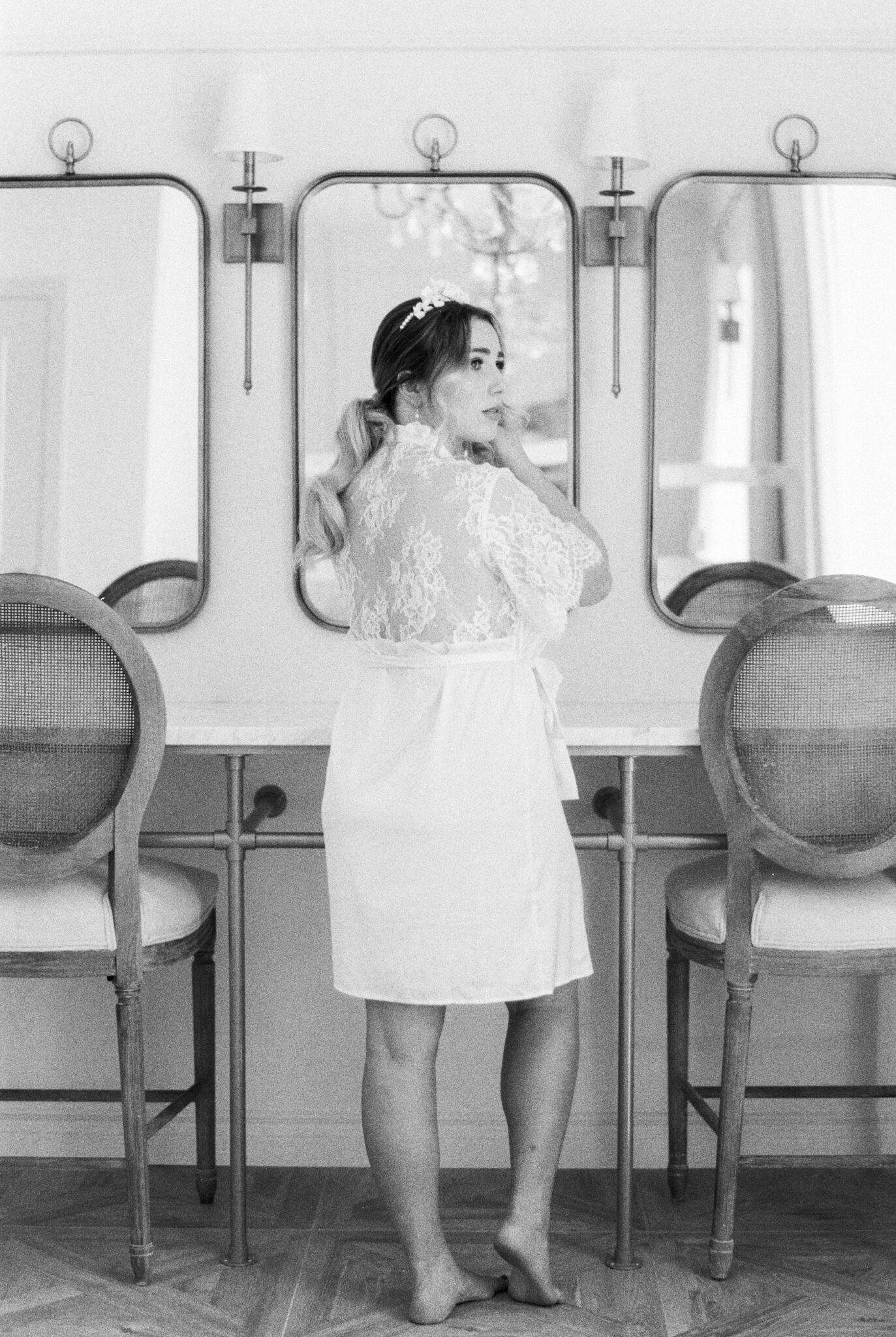 Beautiful bride getting ready on her wedding day at Sparrow Lane wearing Blisse Lace Bridal Robe By Catalfo