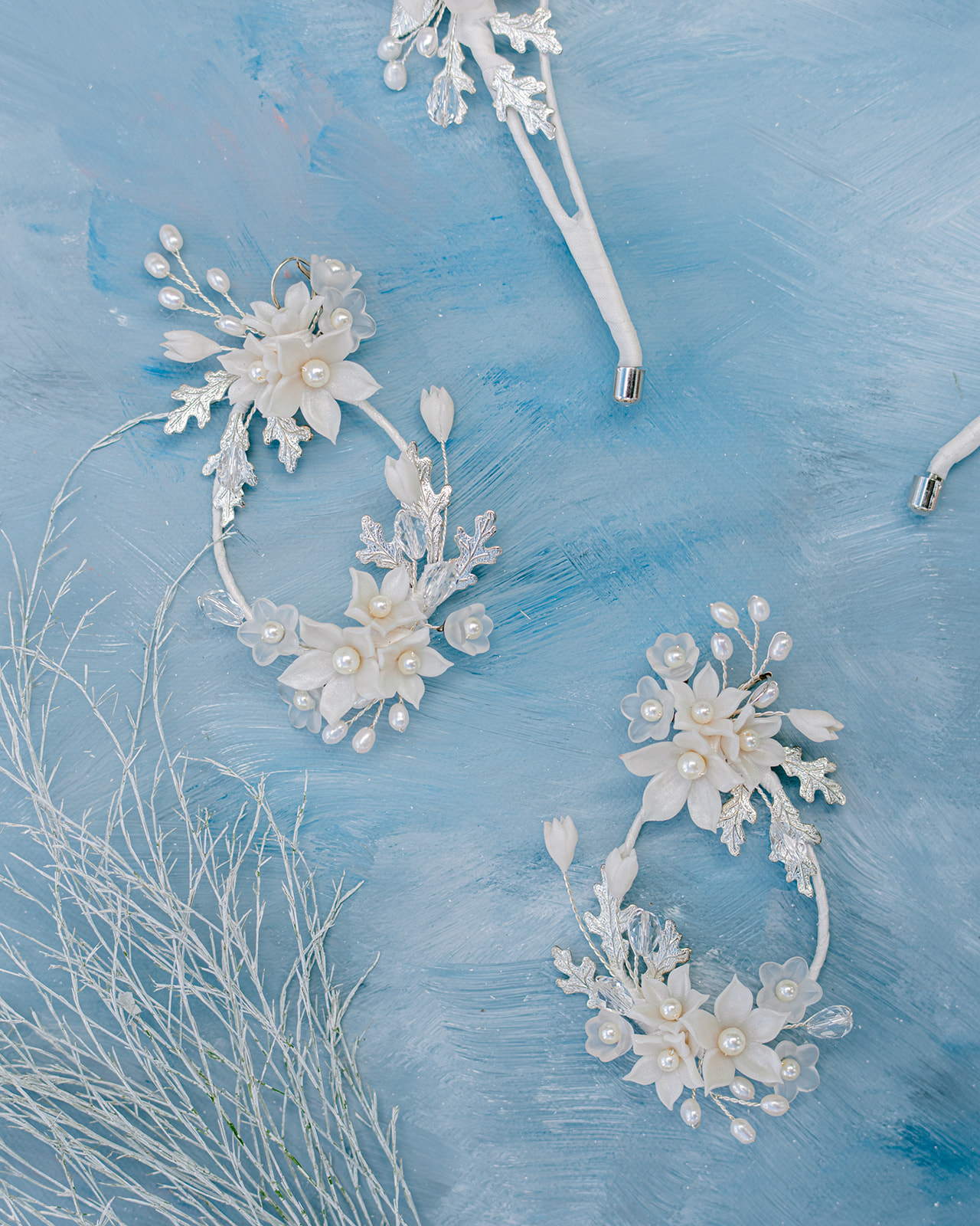 Soft, coastal-inspired blues + whites, stunning floral and pearl bridal jewelry by Blair Nadeau Bridal