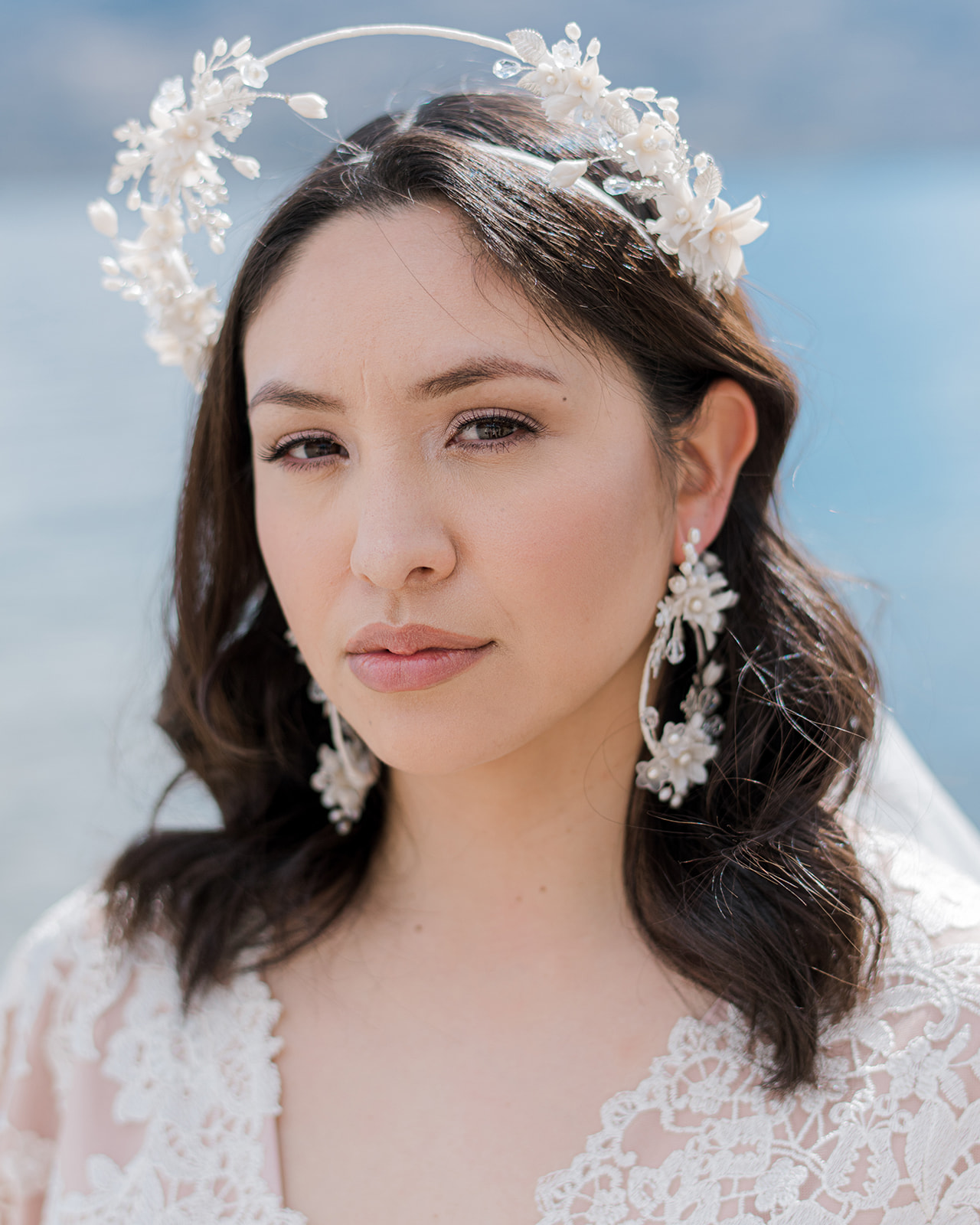 Soft, coastal-inspired blues + whites, stunning floral and pearl bridal jewelry by Blair Nadeau Bridal